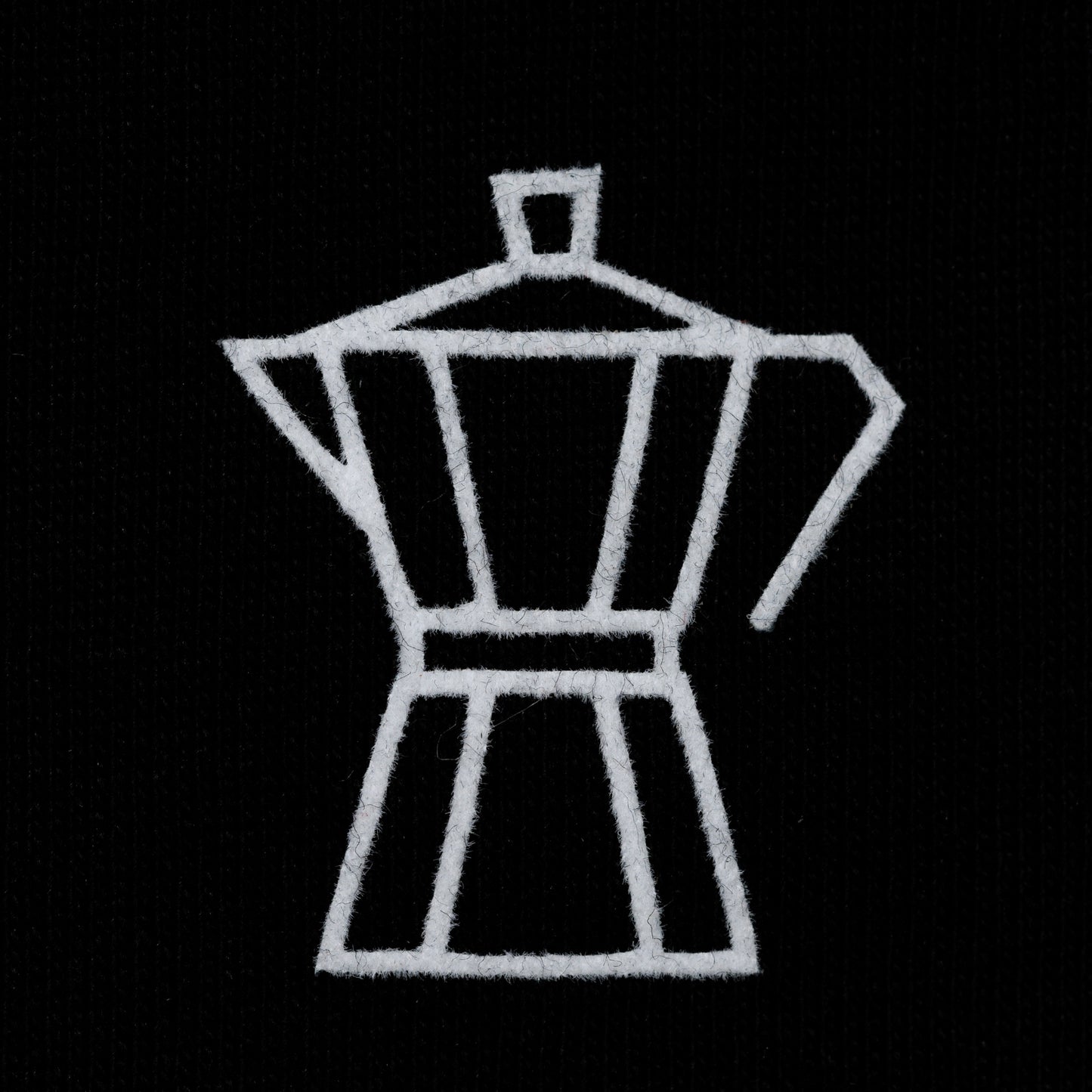 Nahaufnahme des gestickten Mokkaners auf dem Coffee Circle T-Shirt – Limited Edition aus Bio-Baumwolle.