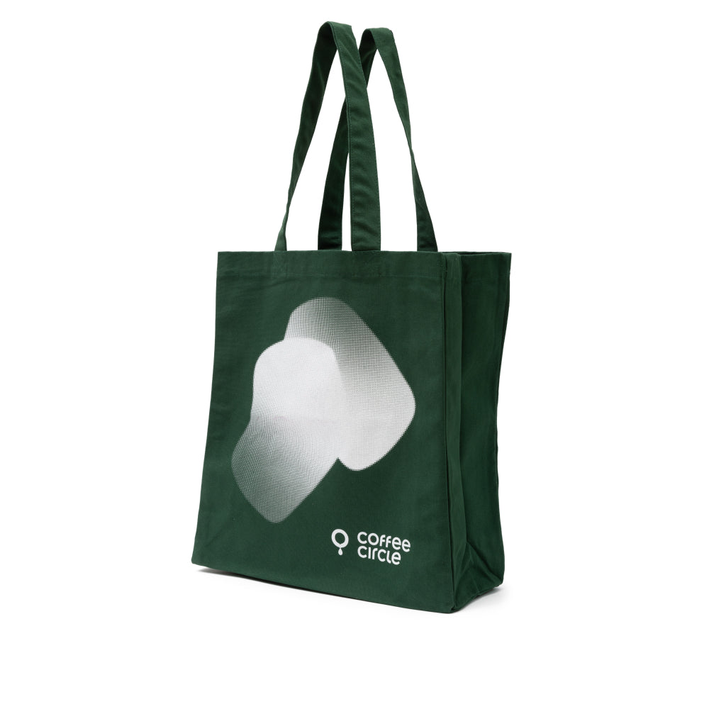 Coffee Circle Tote Bag aus robustem Fairtrade Baumwollmaterial in dunklem Grün mit weißem Druck.